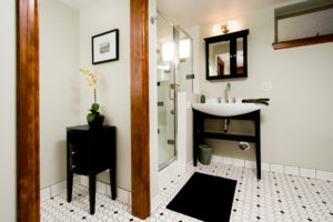 HighCraft-Builders-transitional-bathroom-in-black-and-white-with-free-standing-vanity