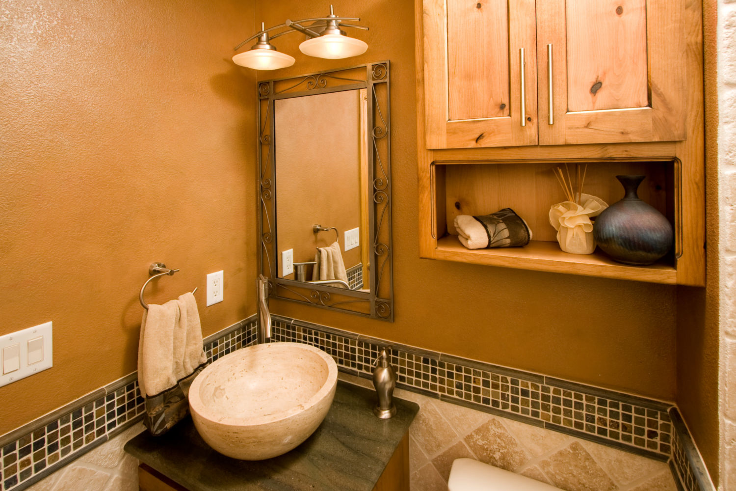 HighCraft-Builders-rustic-powder-bathroom-remodel-with-stone-vessel-sink-and-knotty-cabinets