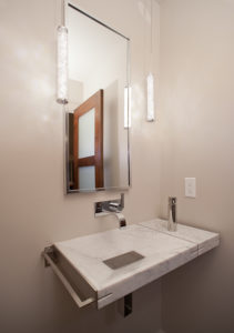 HighCraft-Builders-modern-bathroom-remodel-with-wall-mounted-sink-and-faucet
