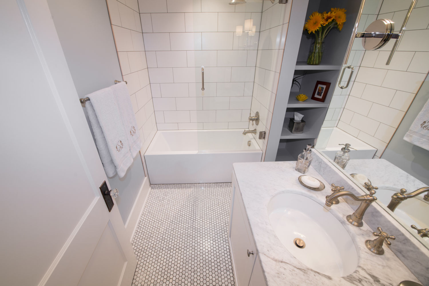 HighCraft-Builders-classic-white-bathroom-remodel-hex-floor-subway-tile-shower-marble-counter-top