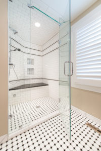 HighCraft-Builders-traditional-black-and-white-walk-in-master-shower-with-black-dot-octagon-floor