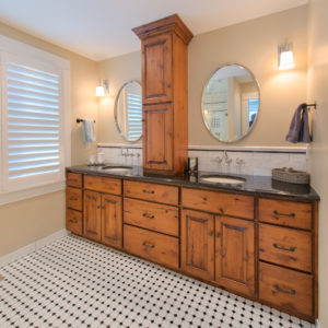 HighCraft-Builders-rustic-vanity-with-hex-dot-floors-and-circular-mirrors