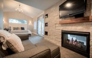 Cozy-fireplace-and-sofa-in-master-suite-den-Loveland-Colorado