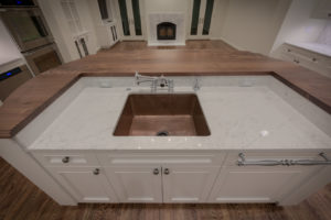 HighCraft-Builders-kitchen-remodel-with-butcher-block-counter-copper-sink-white-cabinets-and-pot-filler-faucet