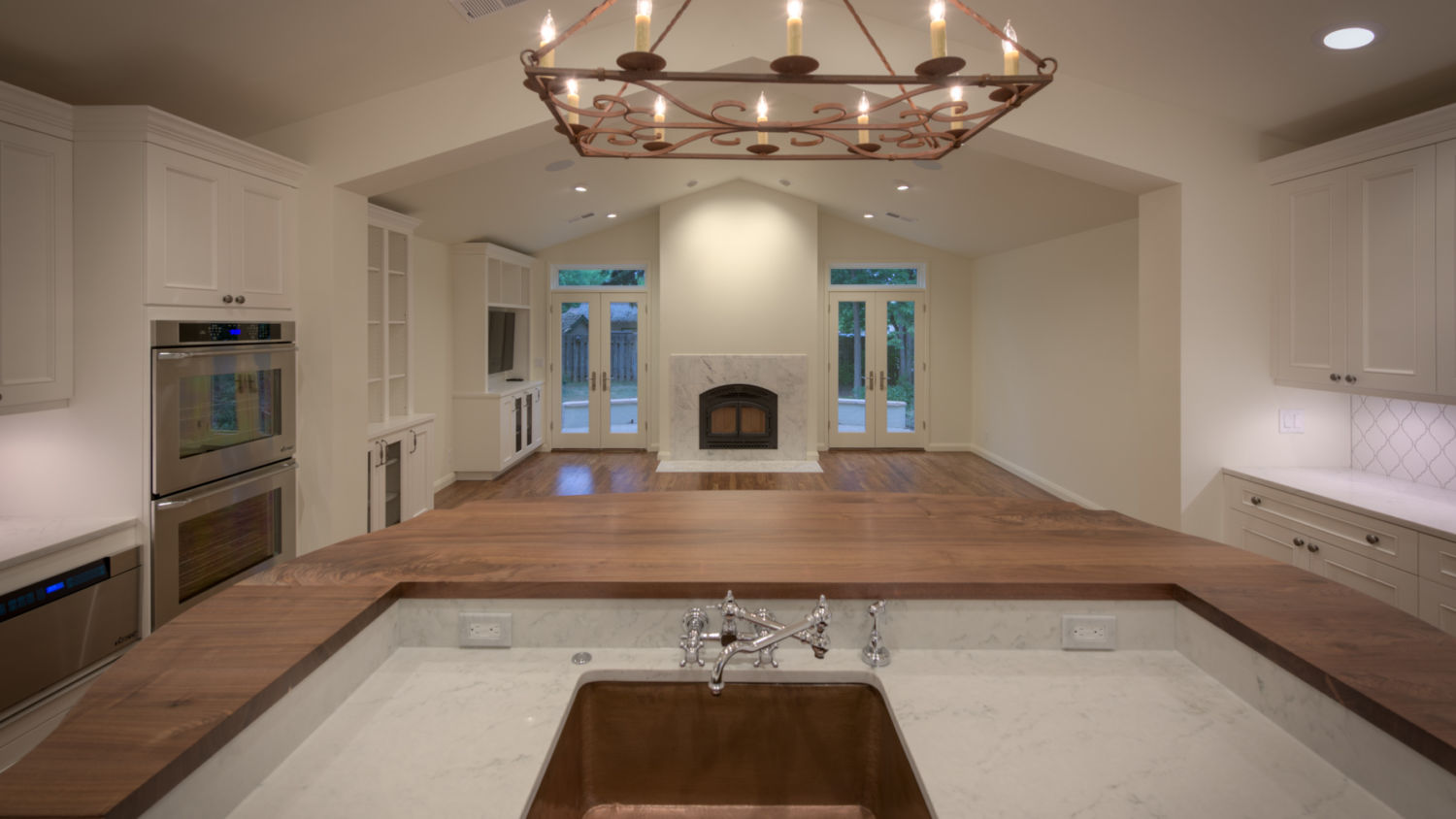 HighCraft-Builders-traditional-kitchen-remodel-white-fireplace-custom-butcher-block-counter-copper-sink