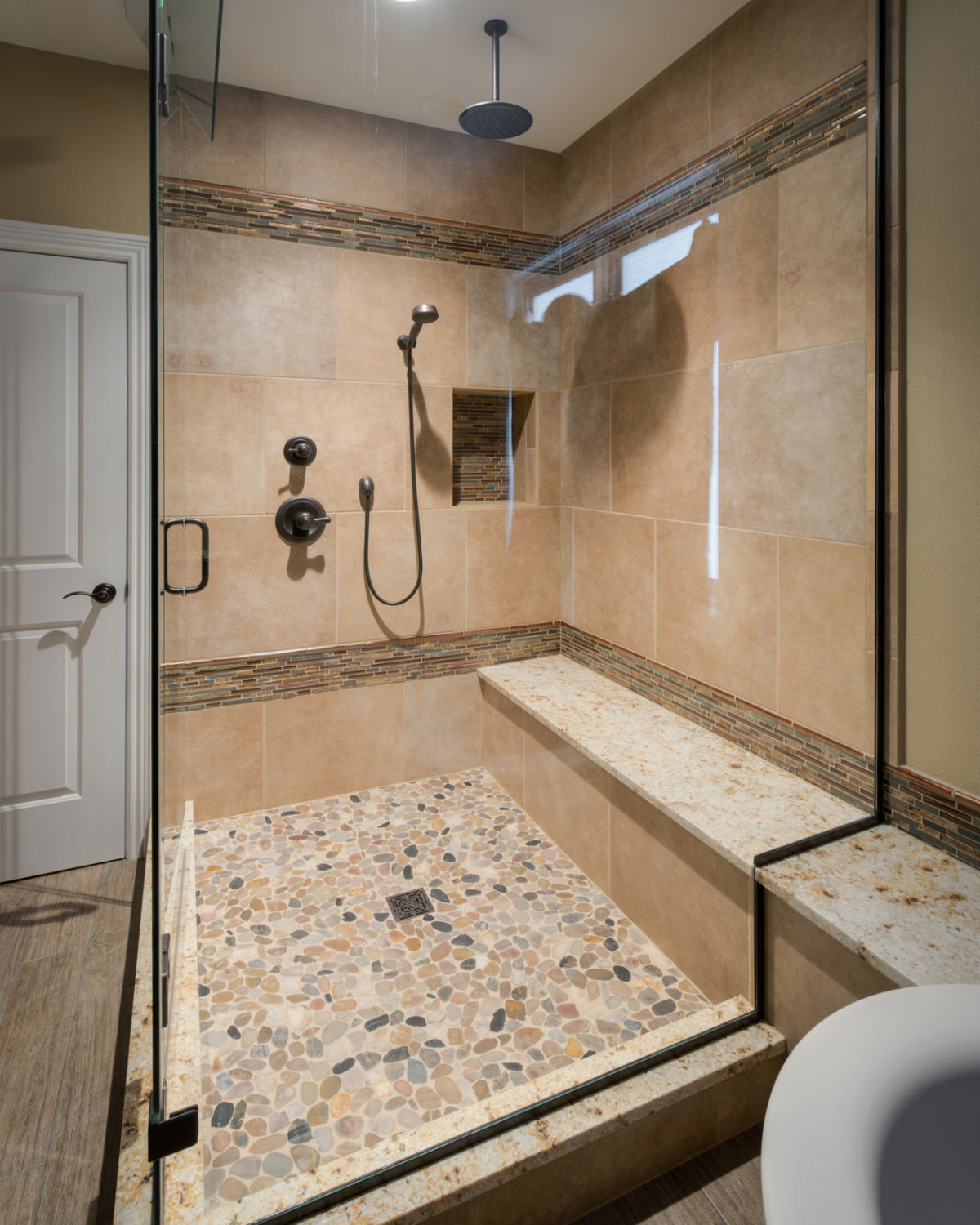 Master shower with pebble floor