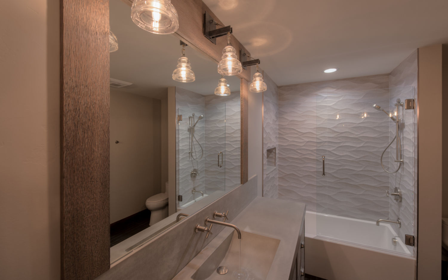 full-bathroom-remodel-sconce-lights-custom-mirror