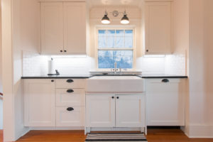HighCraft-Builders-transitional-white-kitchen-with-farmhouse-sink-original-refinished-floors