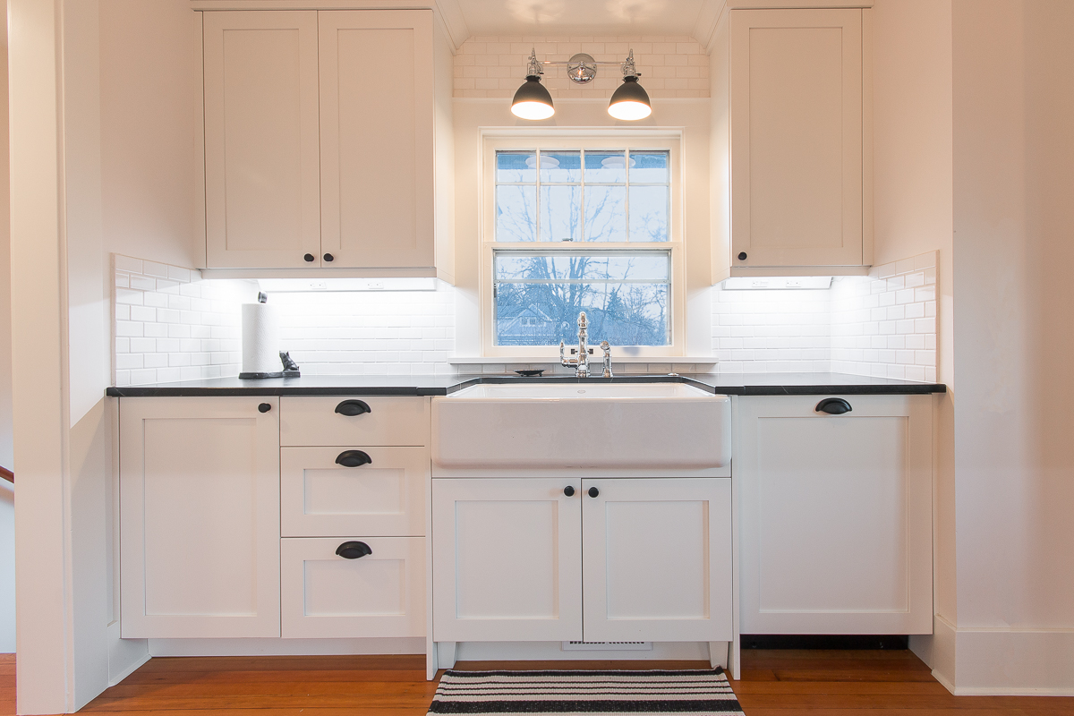 HighCraft-Builders-transitional-white-kitchen-with-farmhouse-sink-original-refinished-floors