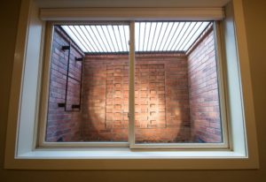 highcraft-builders-basement-remodel-custom-brick-window-well