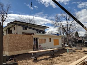 HighCraft Builders crane lowers beam old town renovation