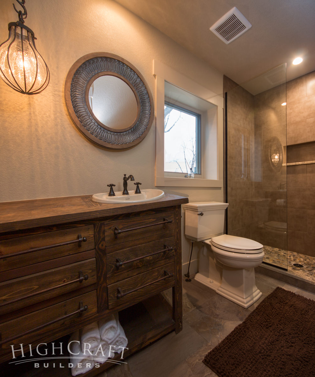 rustic remodel bathroom handcrafted vanity pebble tile shower