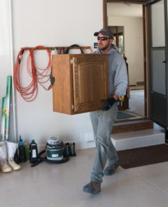 HighCraft project manager carries salvaged cabinet