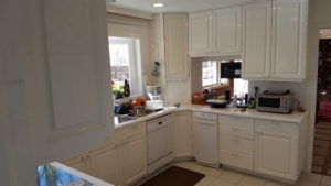 cluttered white kitchen before remodel