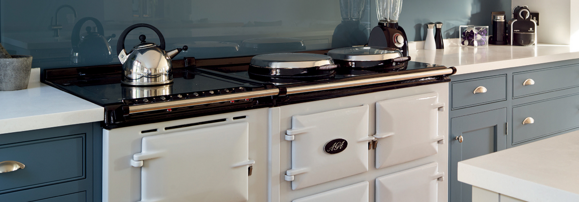 cast iron white AGA range in blue kitchen