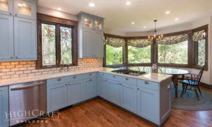 Traditional-blue-kitchen-peninsula-stained-trim