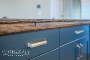 Open-concept-farmhouse-kitchen-blue-cabinets-wood-top