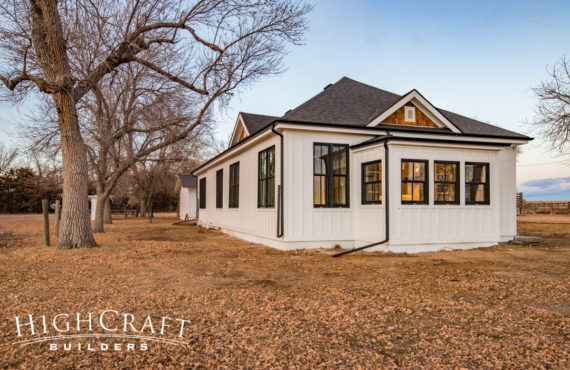 Open-concept-farmhouse-white-painted-exterior-cedar-shake-gables