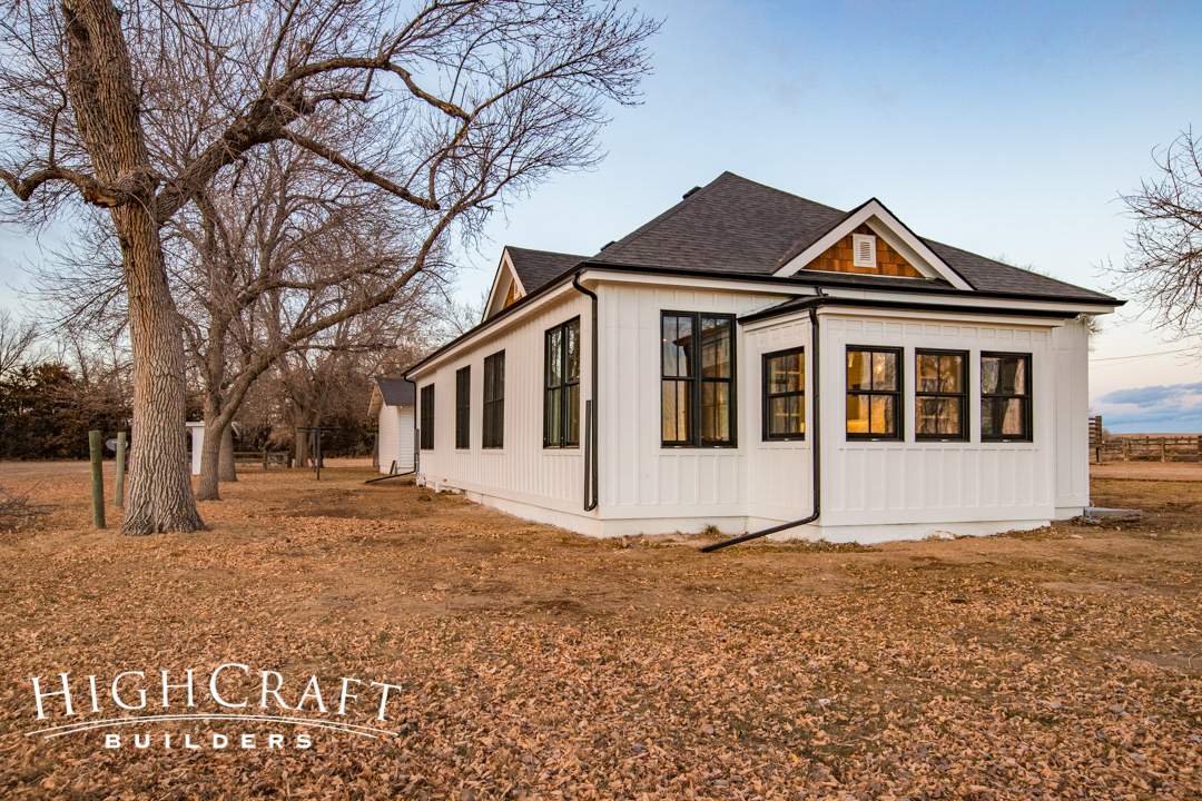 Open-concept-farmhouse-white-painted-exterior-cedar-shake-gables