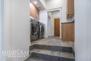 new addition laundry room melamine cabinets quartz countertops slate flooring