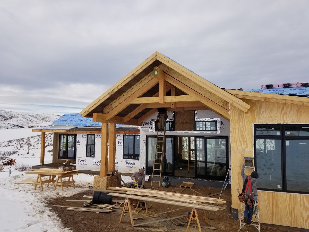 mountain custom home construction exterior dining room snow December 2019