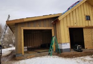 mountain custom home construction garage exterior siding snow December 2019