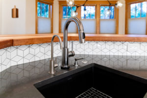 old town kitchen remodeling sink fixture geometric tile backsplash