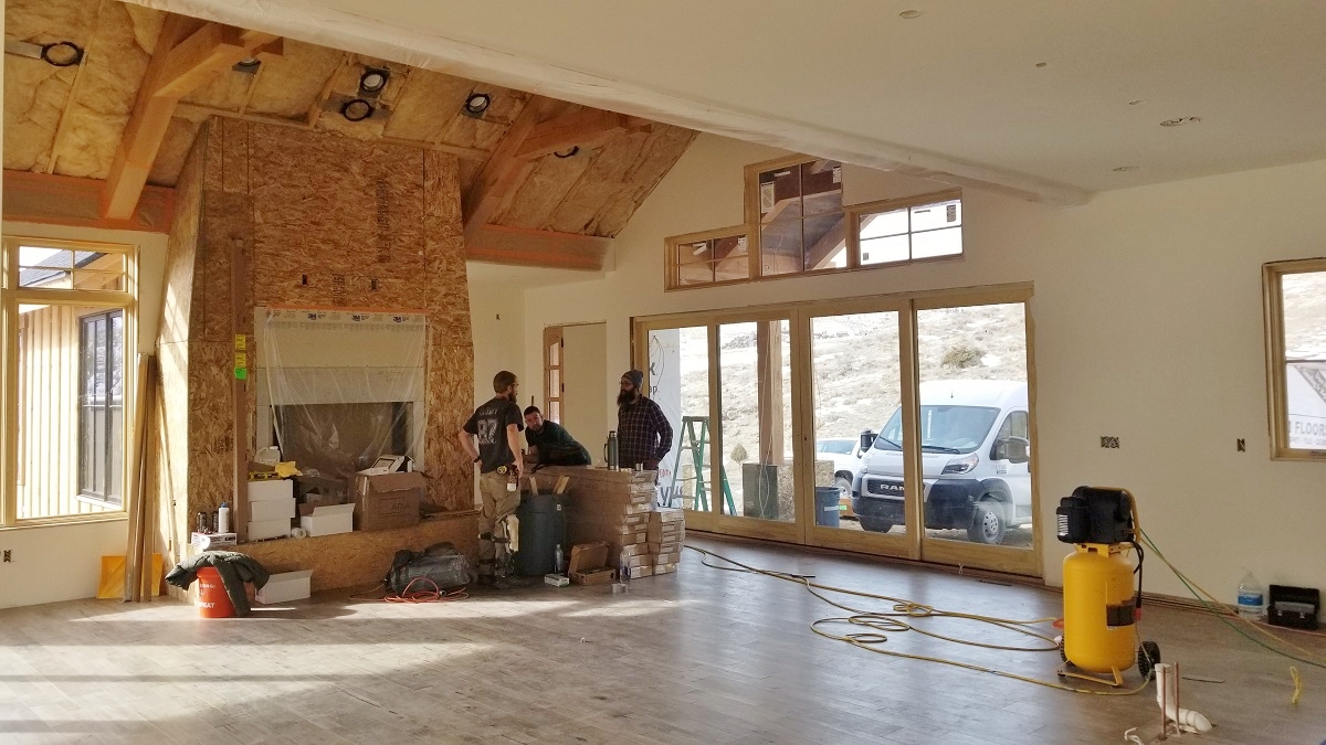 custom_house_builder_contractor_companies_fireplace_front_door_progress_flooring_installed