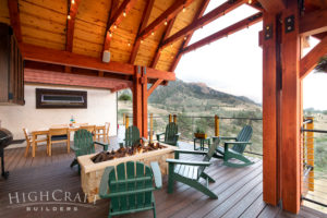 AFTER_exterior_upper_deck_remodel_loveland_co_gas_fire_feature_adirondack_chairs_timber_framing