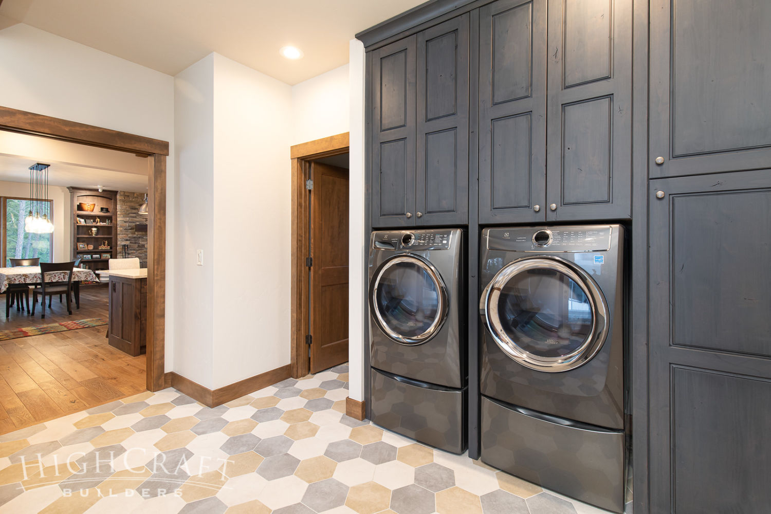 custom_home_construction_laundry_mudroom_washer_dryer_view_to_dining