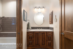 custom_home_construction_main_bathroom_sink_vanity_oval_mirror