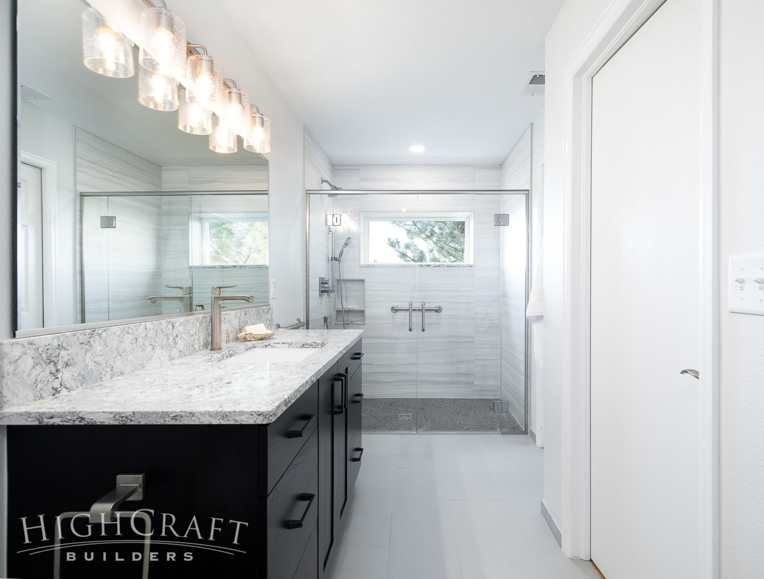 bathroom_and_remodeling_fort_collins_co_glass_shower_quartz_countertop_hickory_vanity