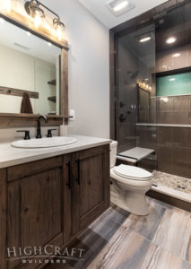 custom_home_builder_colorado_basement_bathroom_vanity_brown_tile_shower