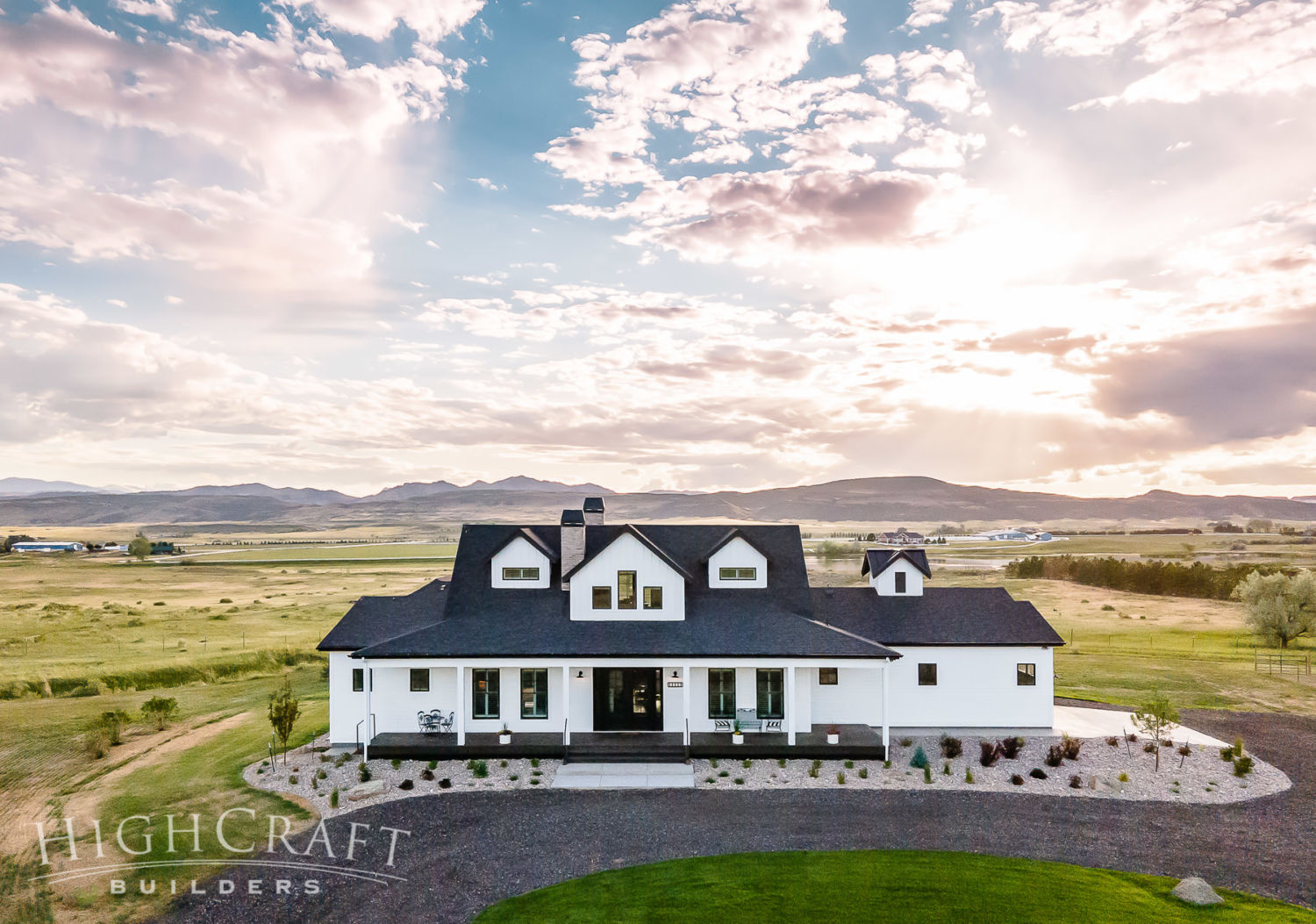 custom_home_builder_northern_co_white_farmhouse_front_afternoon_sky