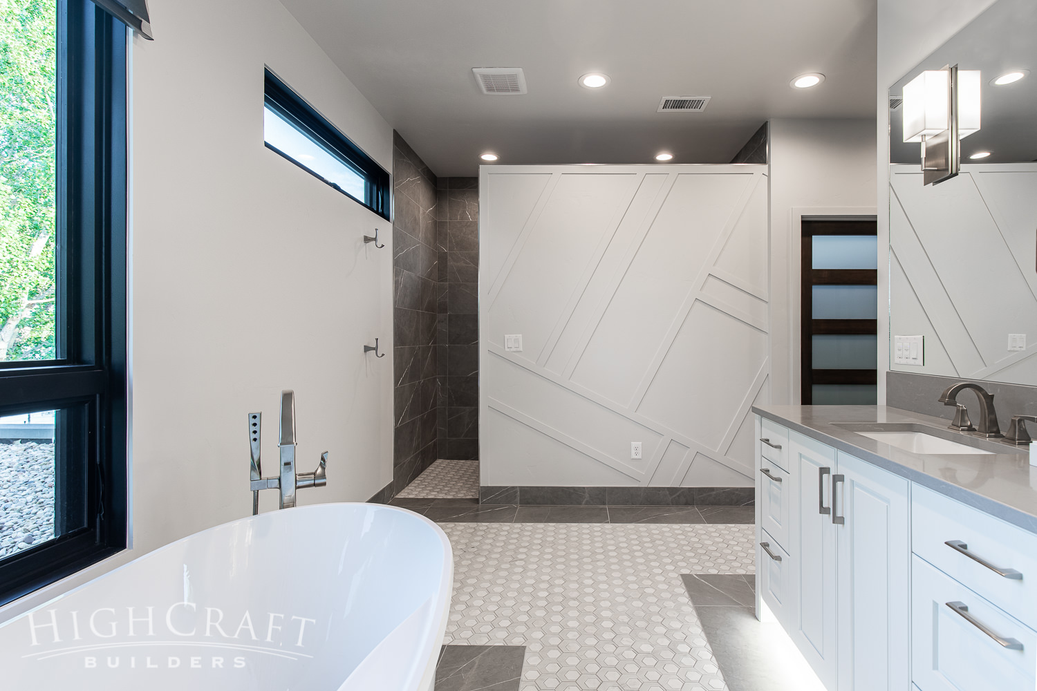 Lake-Loveland-new-construction-master-bathroom-tile-cabinets-wall