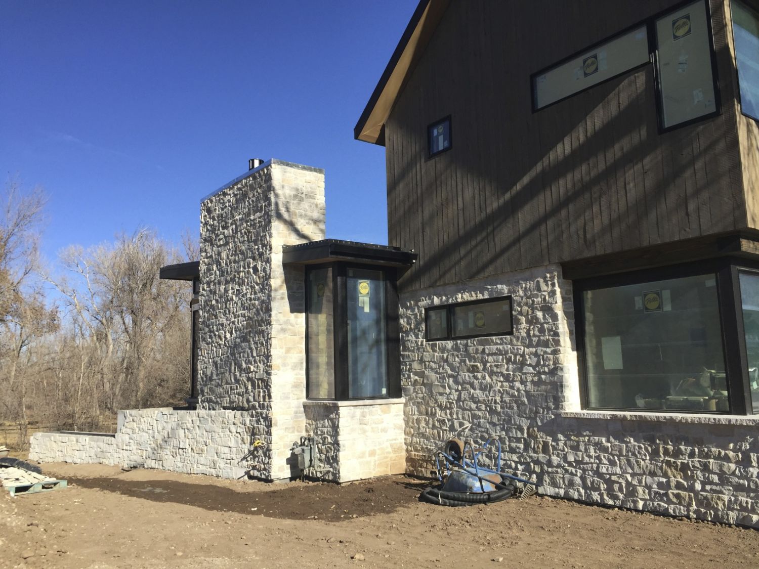 custom-home-building-exterior-northwest-corner-stone-week-30