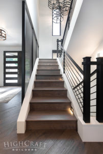 contemporary-front-entry-open-stairs-black-metal
