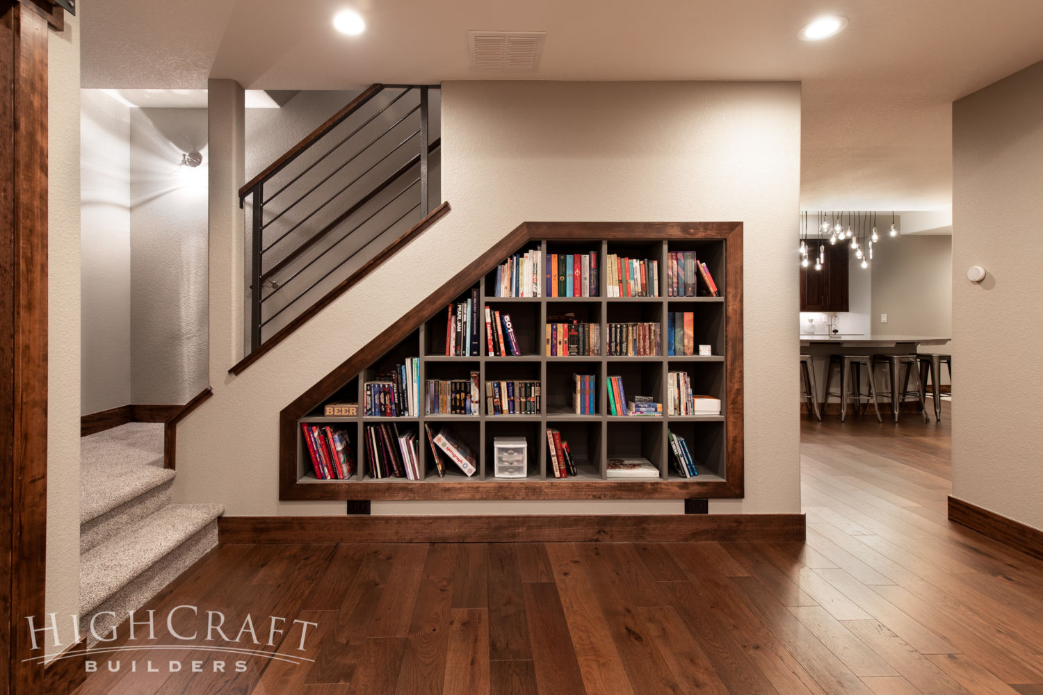 modern rustic basement understair bookshelves