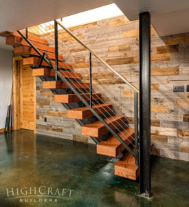 basement-finish-floating-stairs-stained-concrete-flooring