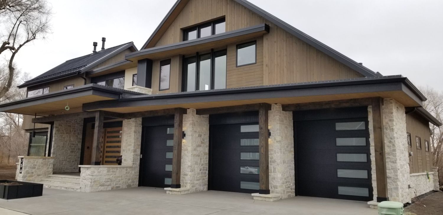 custom-home-construction-fort-collins-co-contemporary-exterior-three-garage-doors