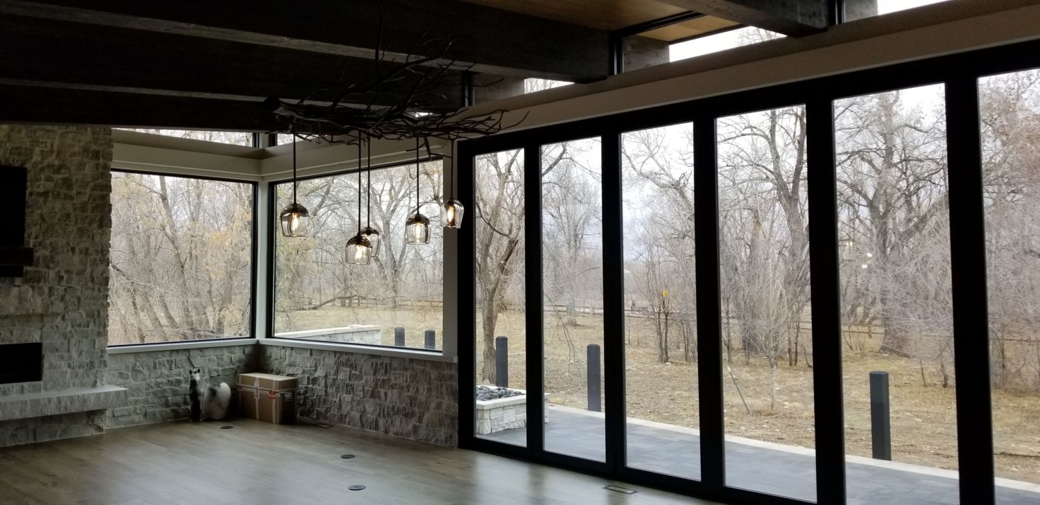 custom-home-construction-fort-collins-co-contemporary-great-room-bifold-glass-doors