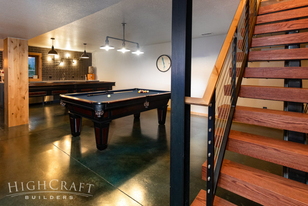basement-finish-pool-table-stained-concrete-flooring-stairs