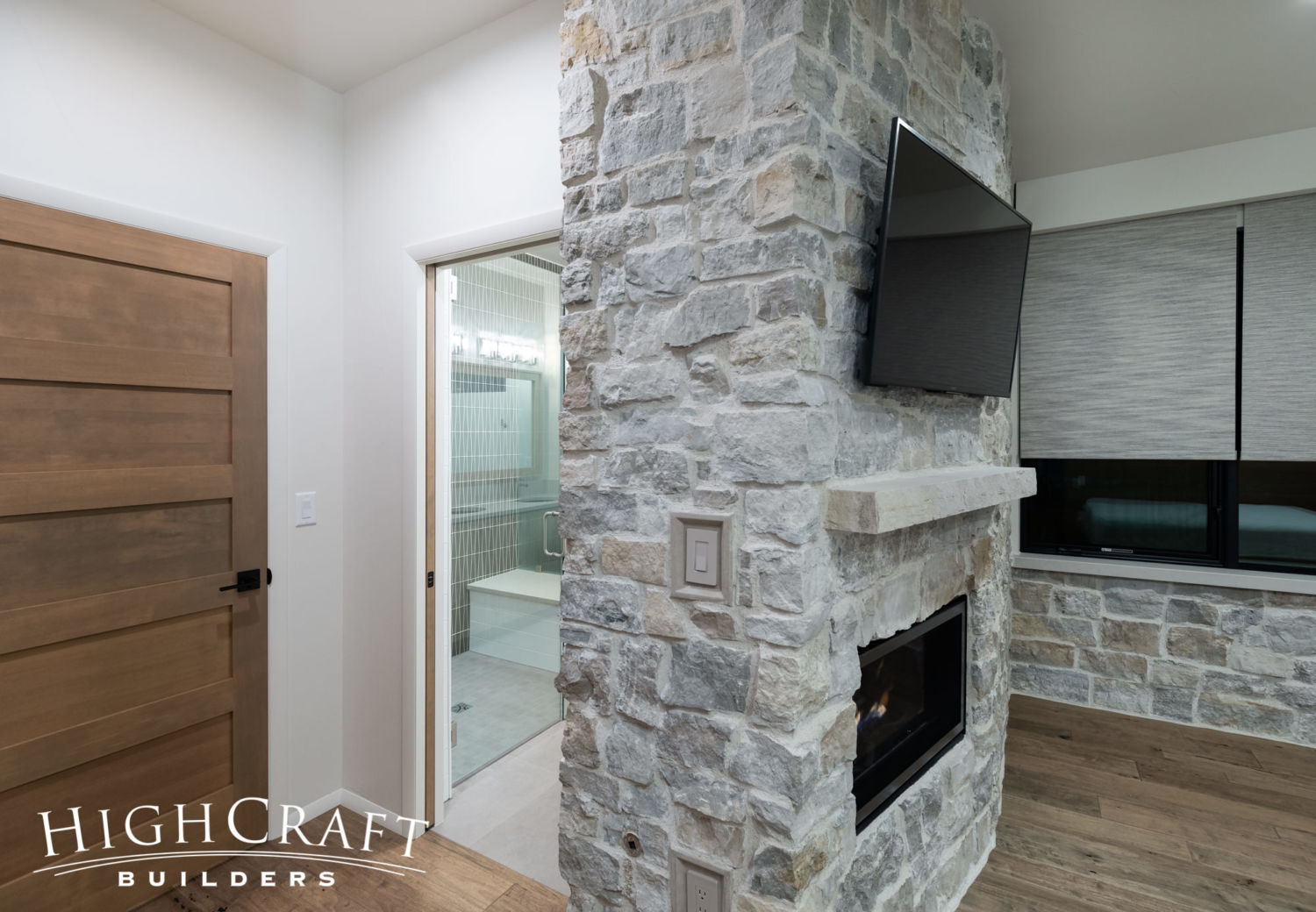 contemporary-custom-home-builder-guest-bedroom-bathroom-fireplace