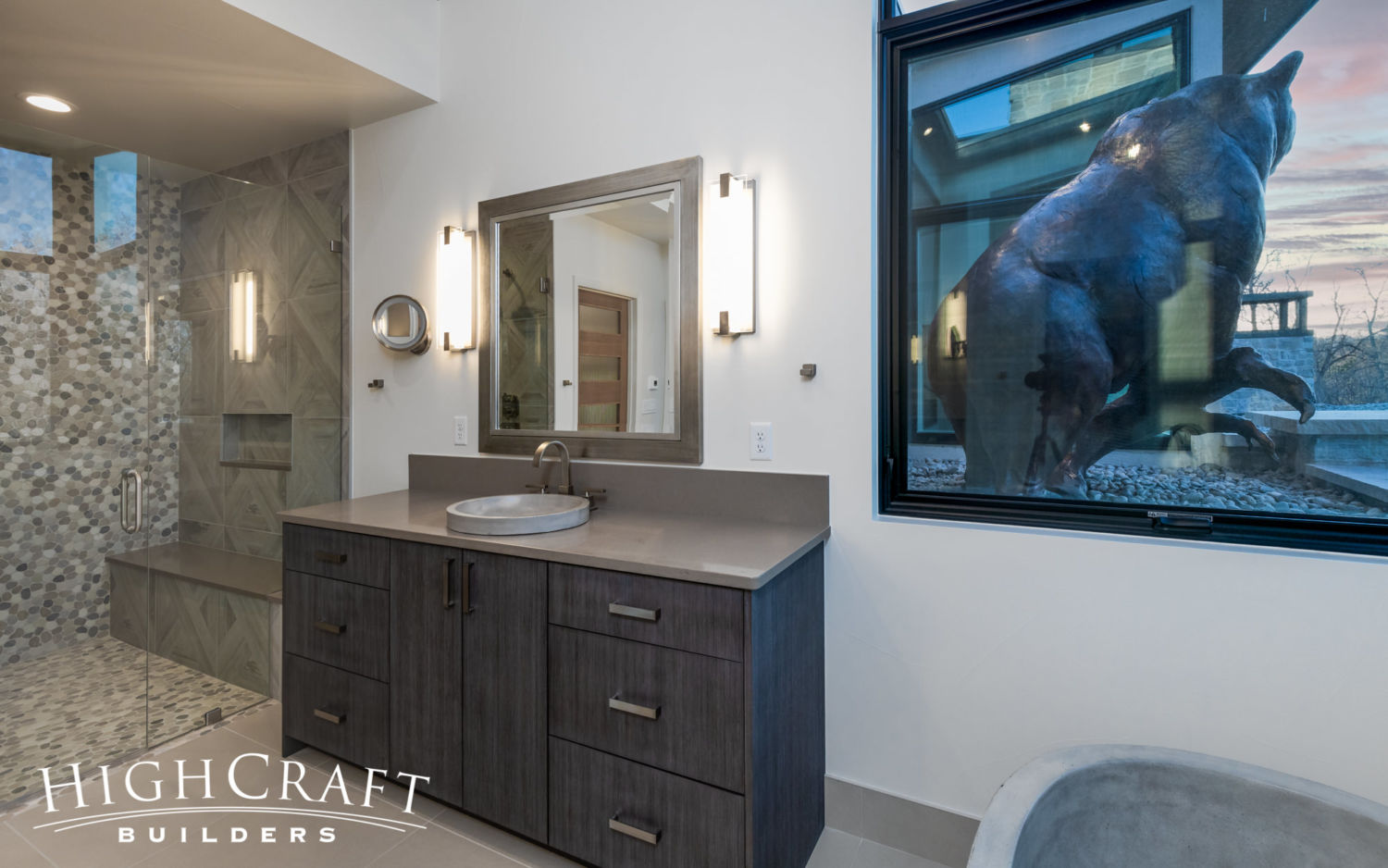 contemporary-custom-home-master-bath-shower-vanity-view-bear-sculpture
