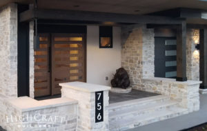 custom-home-builder-fort-collins-co-soft-contemporary-bronze-sculpture-front-porch