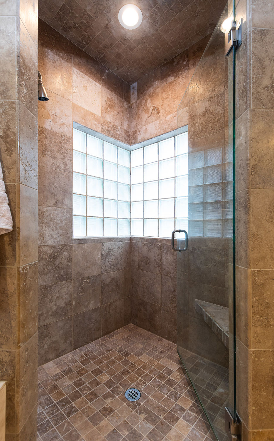 bathroom-showers-remodeling-brown-tile-before-photo