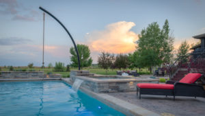 building-contractor-near-me-outdoor-living-swimming-pool-red-lounge-chair-fort-collins-colorado