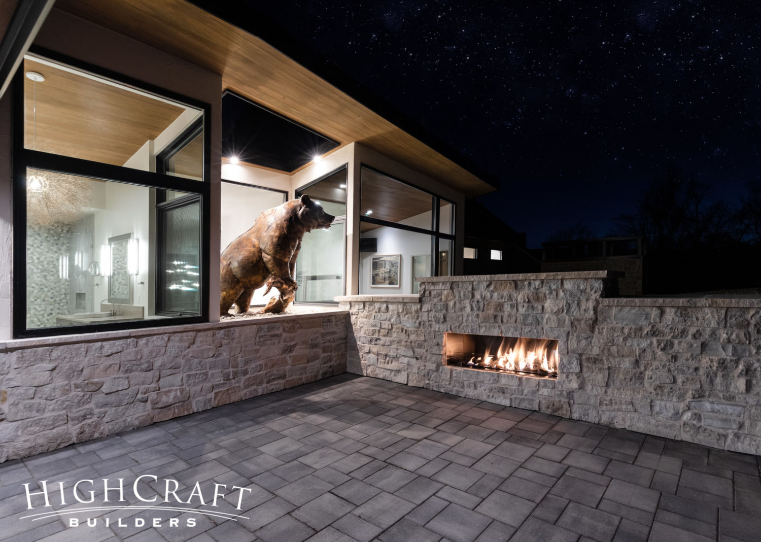 custom-home-builder-fort-collins-co-soft-contemporary-bronze-sculpture-terrace-fireplace-stars