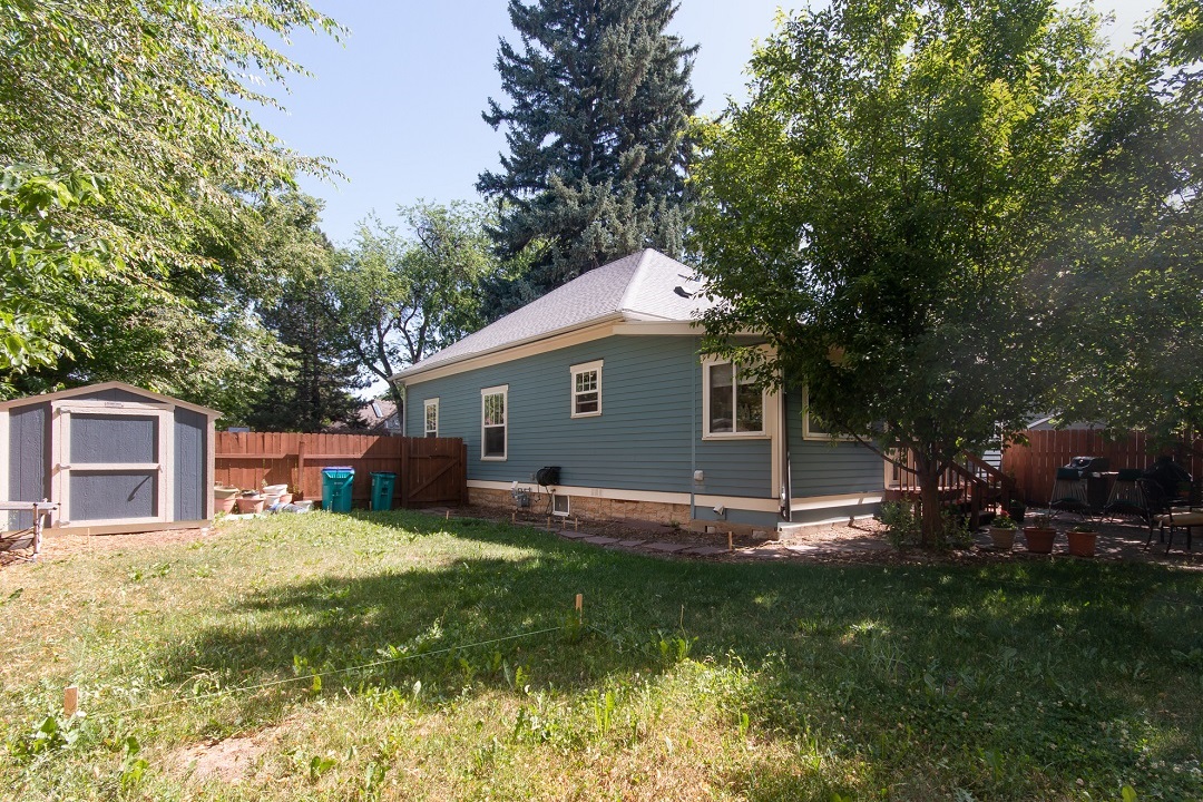 BEFORE_master suite addition backyard blue house