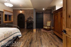 basement-finish-fort-collins-guest-bedroom-black-speakeasy-door